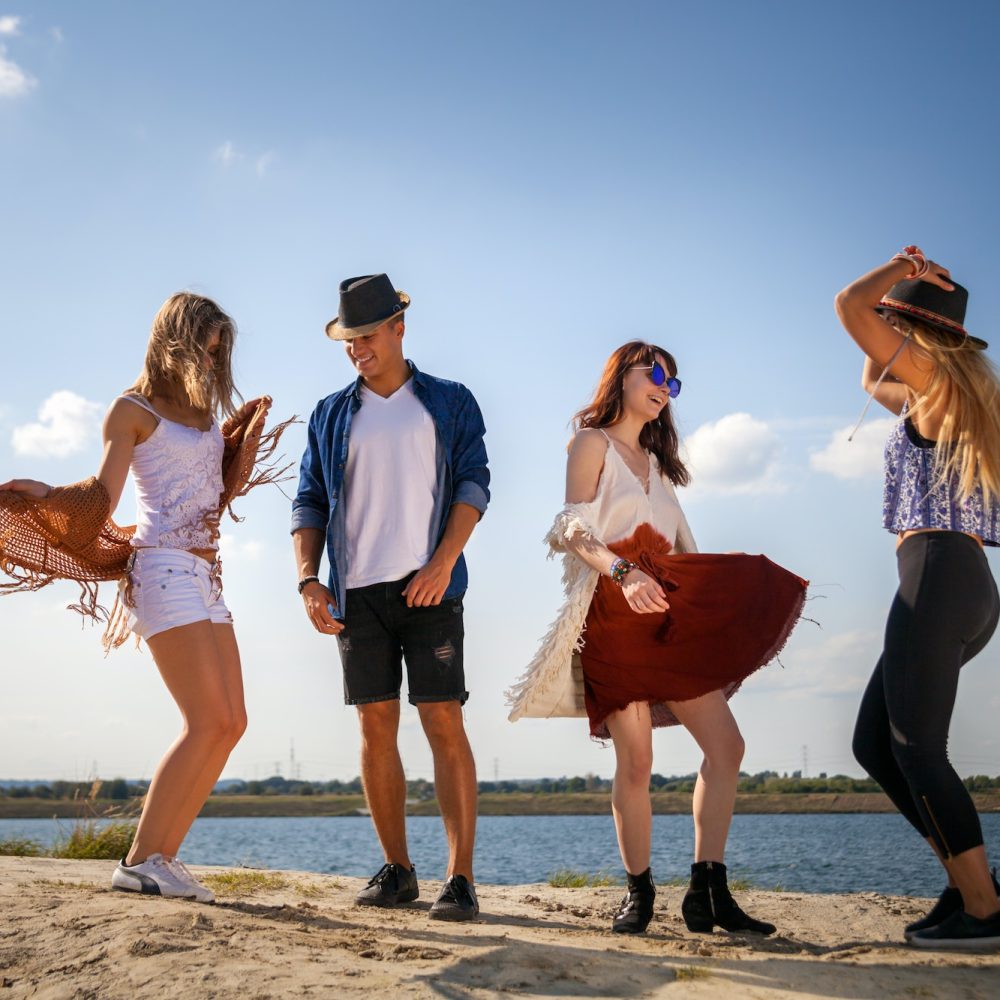 group-of-friends-partying-and-dancing-at-the-beach.jpg
